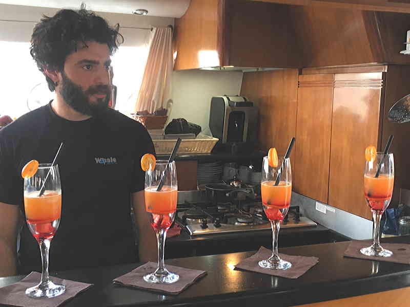 The skipper of crewed catamaran Whale as barman